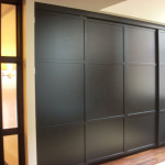Built-in wood cabinet w/ sliding doors