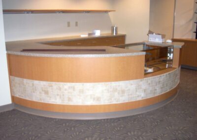 Curved reception desk for Aurora Medical Center.