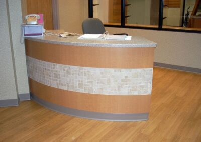 Curved reception desk for Aurora Medical Center.