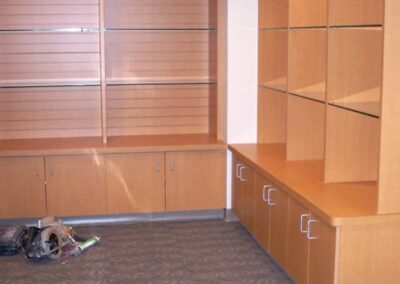 Plastic laminate cabinets with slatwall back for Aurora Medical Center.